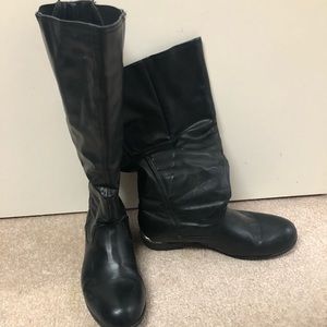 Black knee-high wide calf boots.
